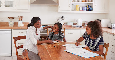 a family studying the Bible