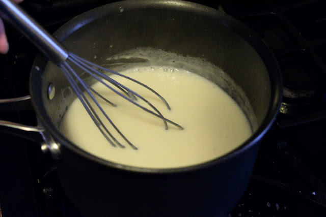 The sauce thickening on the stove. 