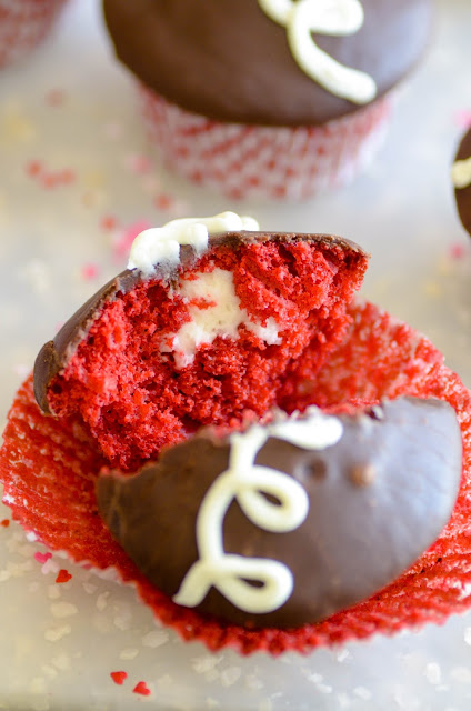 Copycat Hostess Cupcakes with a Valentine's day twist. These cream filled red velvet cupcakes are topped with ganache and are oh-so-good!