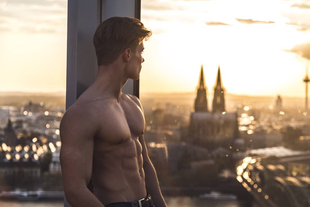fit-shirtless-muscular-dude-impressive-skyscraper-killer-view