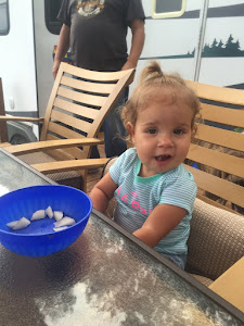 Rory eating one of the pears she picked all bu herself.