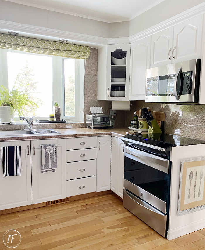 An affordable kitchen refresh and how to update kitchen cabinets without replacing them plus how to repurpose a small hutch into an island and pantry.
