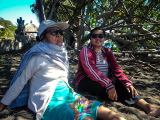 Old Woman And Young Woman Enjoy A Holiday On The Tropical Beach Under The Beach Tree At The Village Umeanyar North Bali Indonesia