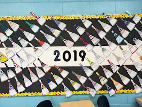 I love the movement in this math bulletin board display of Ms. Degnan's matholution pennants.