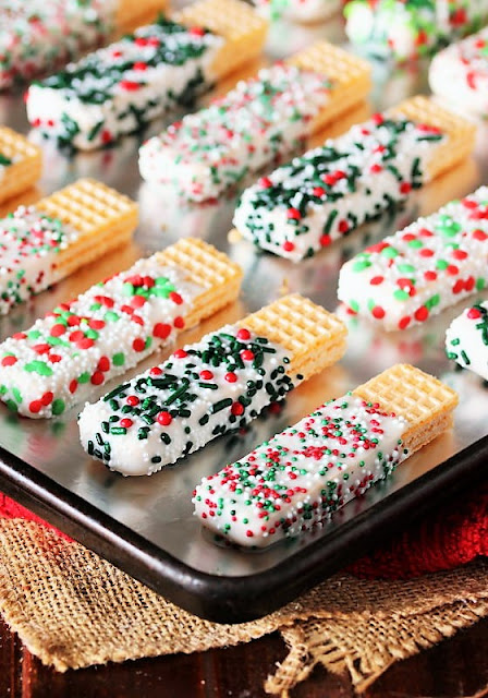 Christmas White Chocolate-Dipped Sugar Wafers on Baking Sheet Image