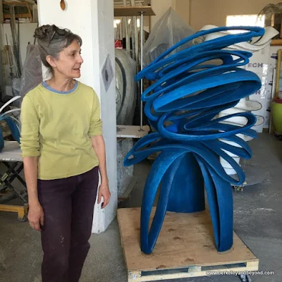 artist Mary Oros next to her "Blue Moves" concrete sculpture in Benicia, California