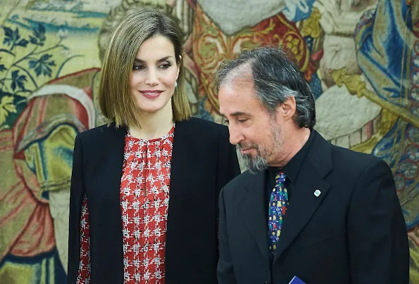 Queen Letizia  attends an audience with a Representation of Gypsy Secretariat Foundation at Zarzuela Palace. Queen Letizia wore ZARA Cape Jacket - HUGO BOSS Taru Trousers - Magrit pumps Tous Jewelery
