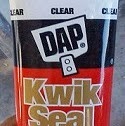 Use Kwik Seal white silicone caulking to seal the container