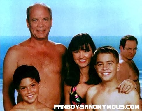 Seinfeld character George Costanza (Jason Alexander) accidentally photobombs his employer's family on holiday