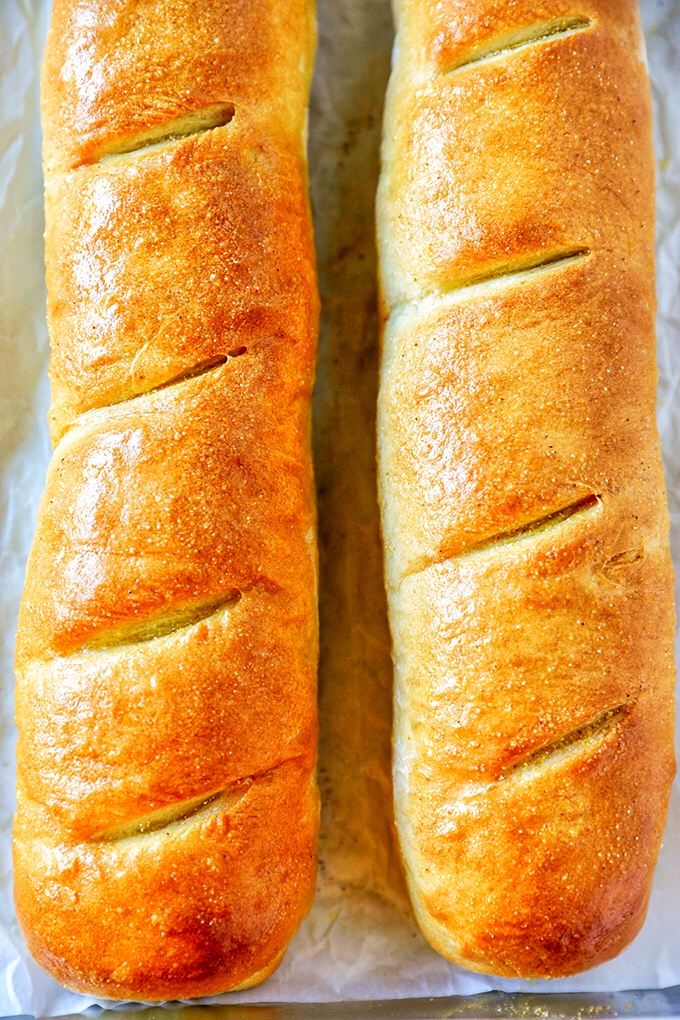This homemade French Bread Recipe is so easy to make and absolutely delicious. Soft, fluffy homemade French bread with a delicious golden brown crust, this simple homemade bread does not disappoint. 