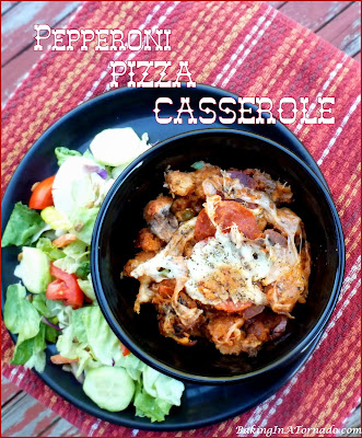 Pepperoni Pizza Casserole is the casserole version of a pepperoni pizza featuring a crouton crust baked with sauce, spicy pepperoni and gooey cheese. | Recipe developed by www.BakingInATornado.com | #recipe #dinner