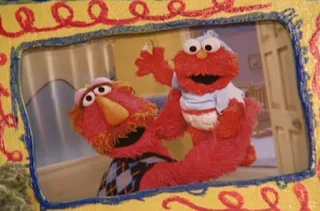 Louie shows Elmo his baby photos. Sesame Street Elmo's Potty Time