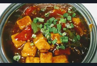 Chilli paneer gravy serving in a bowl