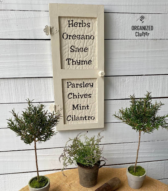 Photo of a farmhouse style wall decor door with herb names