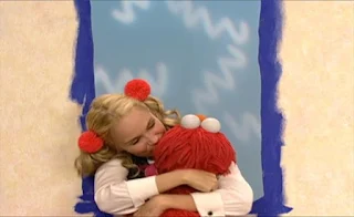 Ms. Noodle hugs Elmo and kisses him many times. Sesame Street Elmo's World Building Things The Noodle Family