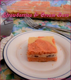 Strawberries and Cream Bars, a creamy cheesecake-like center studded with strawberries in a cookie dough crust and topping. | Recipe developed by www.BakingInATornado.com | #recipe #dessert