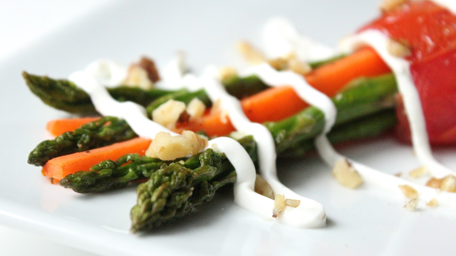 ROASTED ASPARAGUS CARROT BUNDLES WITH WALNUTS AND GOAT CHEESE DRIZZLE