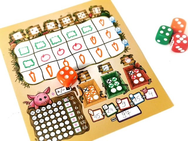 Kości obfitości roll&write dla dzieci, na zdjęciu wypełniona plansza gracza z podliczonymi wynikami, obok leża kostki do gry