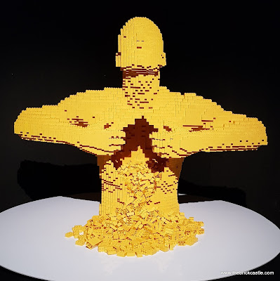 Yellow LEGO man ripping apart his own chest 