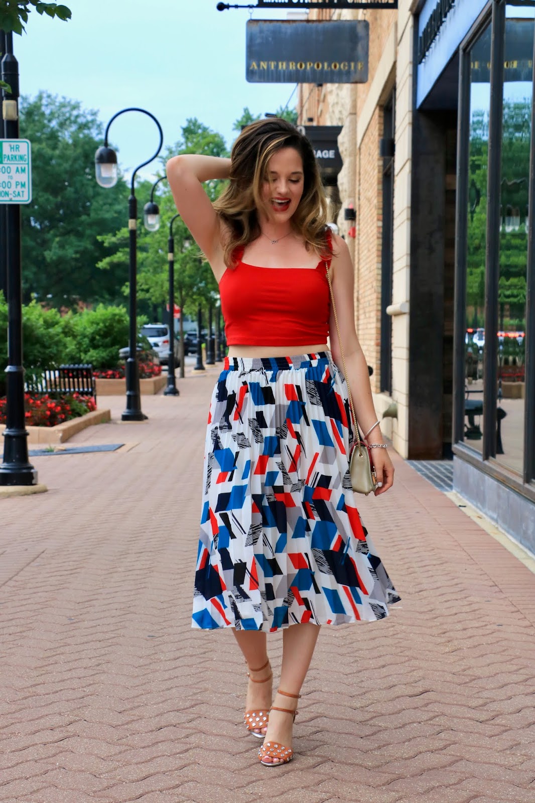 Nyc fashion blogger Kathleen Harper wearing a midi skirt outfit on the streets of Naperville, Illinois.
