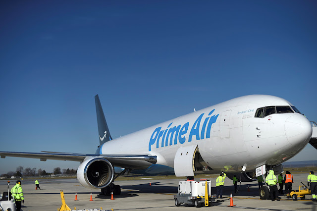 Image Attribute: A wide body aircraft emblazoned with Amazon's Prime logo is unloaded at Lehigh Valley International Airport in Allentown, Pennsylvania, U.S. December 20, 2016. REUTERS/Mark Makela