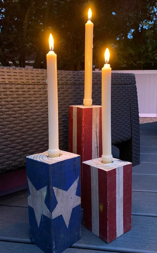 Americana candles with white tapers, lit
