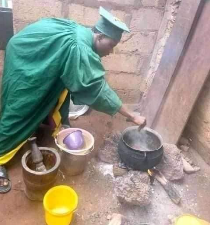 Nigerian man goes Viral as he cooks with his Matriculation Gown (Photos)