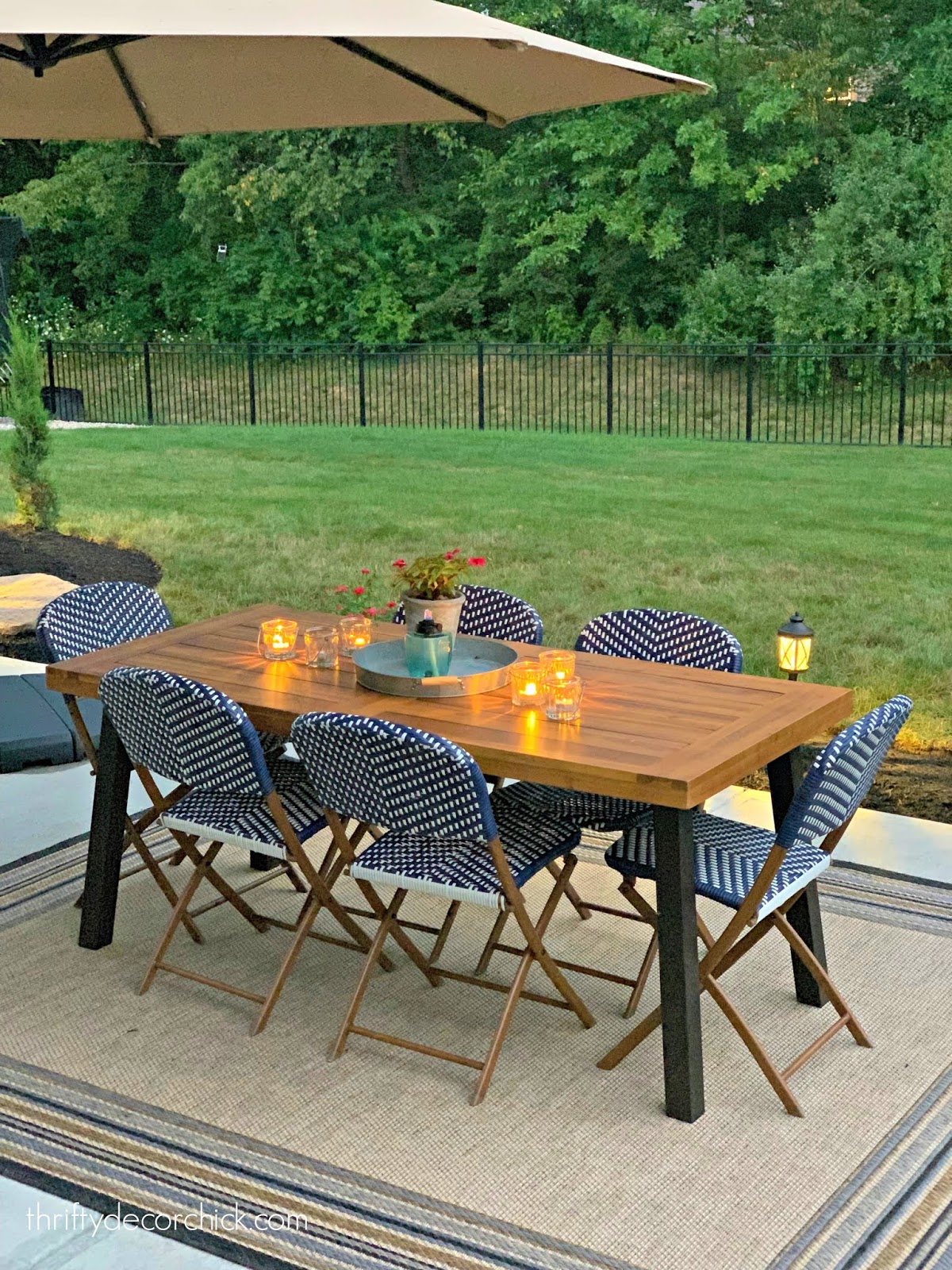 Target folding outdoor chairs around wood table