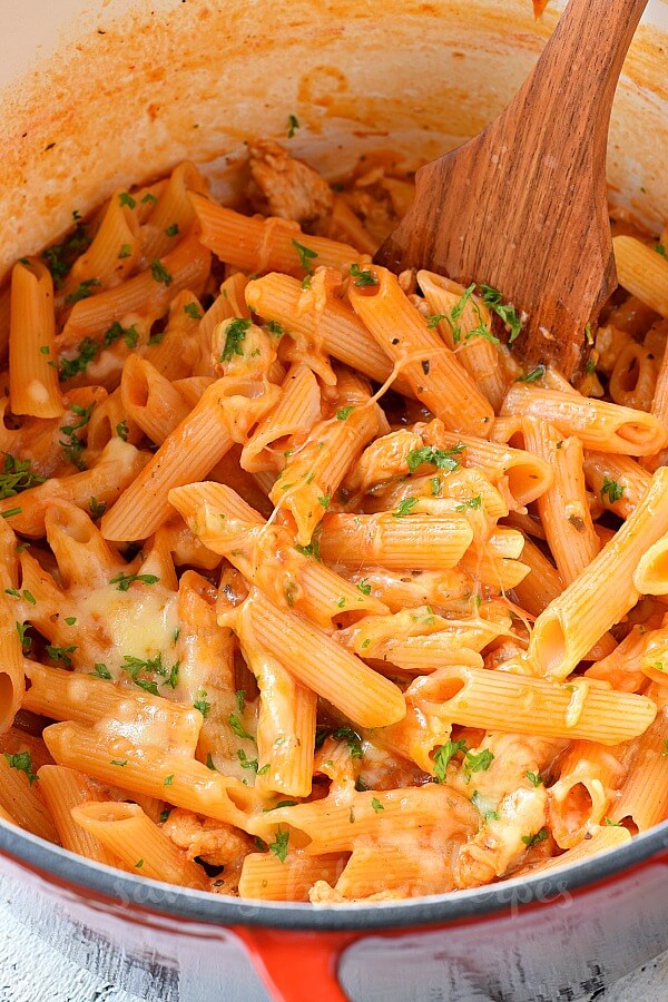 chicken parmesan penne pasta with chopped parsley