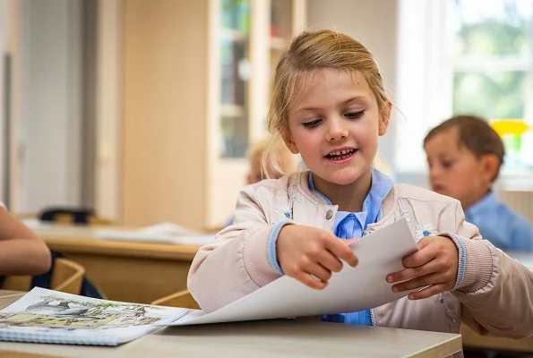 Crown Princess Victoria is wearing Baum und Pferdgarten skirt and blouse. Princess Estelle on the first school day