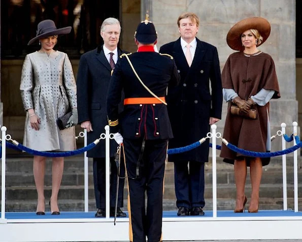 King Philippe and Queen Mathilde met with Queen Maxima and King Willem-Alexander at Dam Square in Amsterdam. Queen wore Natan Dress