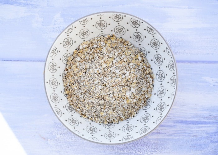 Porridge oats in a patterned white bowl
