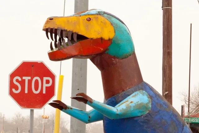 Painted metal T-Rex dinosaur near Weikel's Bakery between Houston and Austin, Texas