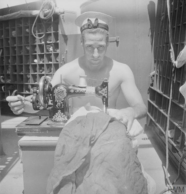 Repairing a signal flag on HMS Alcantara on 12 March 1942 worldwartwo.filminspector.com