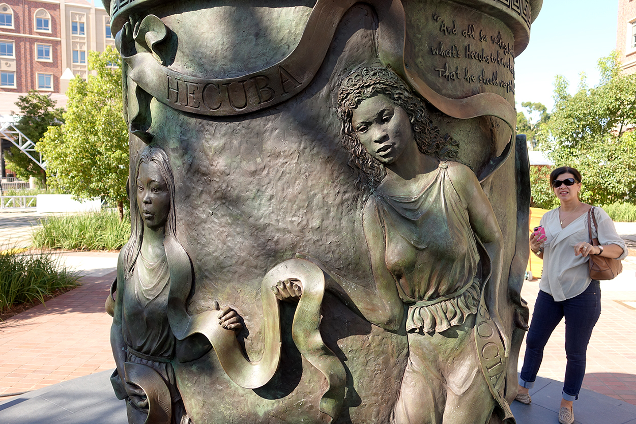 forms traced by light erecting a statue