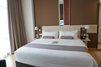 tempat tidur mewah di harper hotel