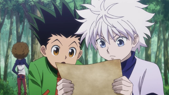 Gon and Killua reading a message while in a forest