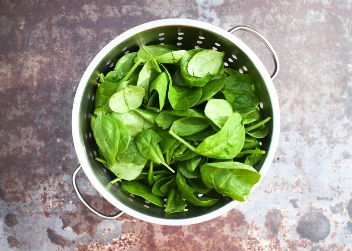 spinach in a colander