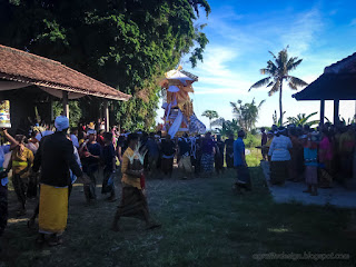 People Carrying Wooden Wadah Or Funeral Pyre Contains Coffins In Balinese Ngaben Ceremony At The Village