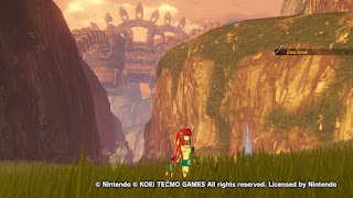Mipha with the hills around Kakariko in the background and Vah Rudania towering above everything