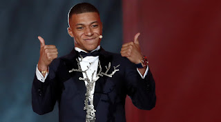 Kylian Mbappe has become the first winner of the Ballon d'Or Under-21 award at a gala ceremony in Paris on Monday.