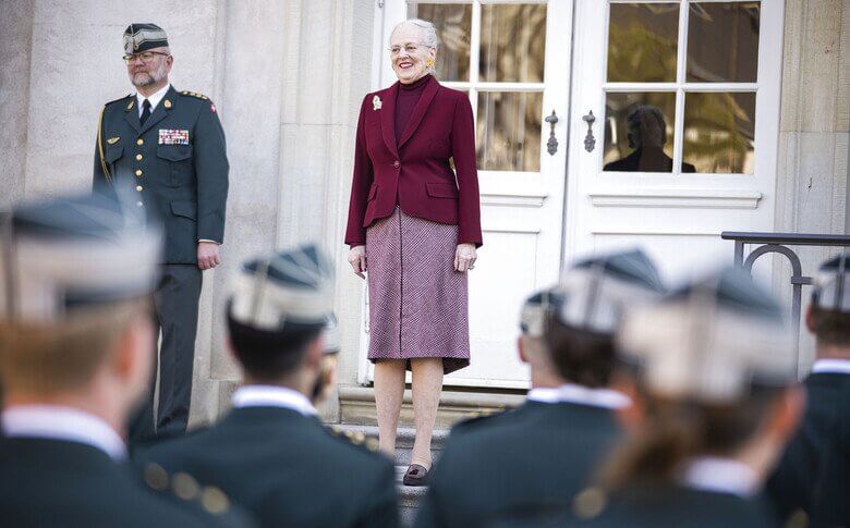 During the three receptions in the garden, Queen Margrethe of Denmark wore a red jacket and beige dress