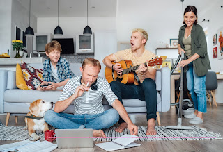 a dad trying to study while his sons are singing and playing acoustic guitar