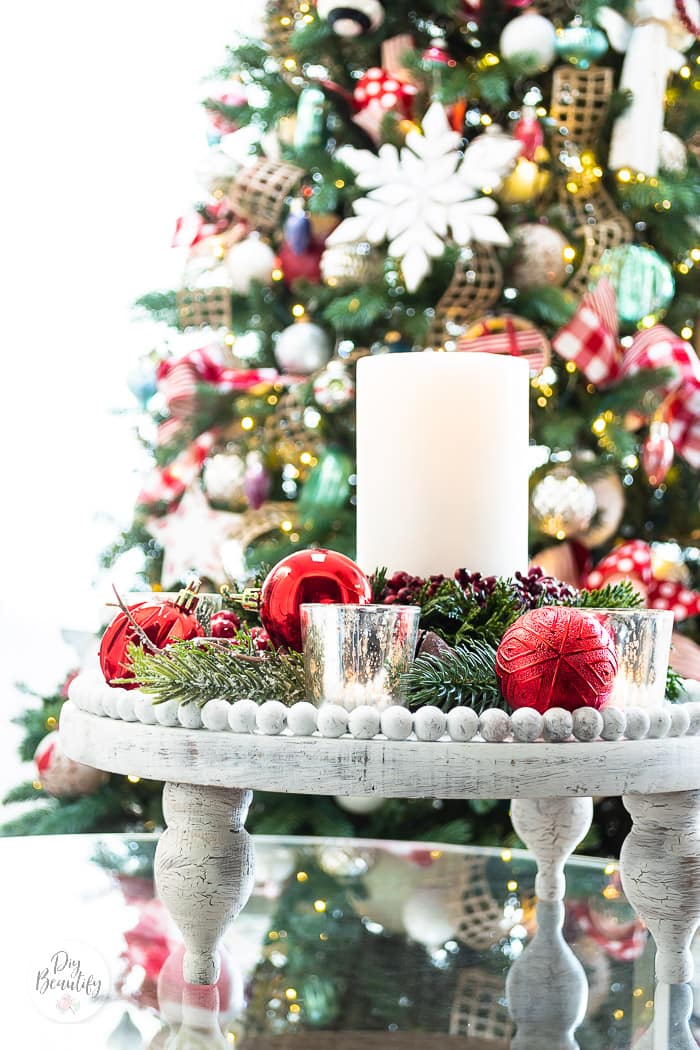 white crackle finish beaded wood tray styled with red ornaments and greenery