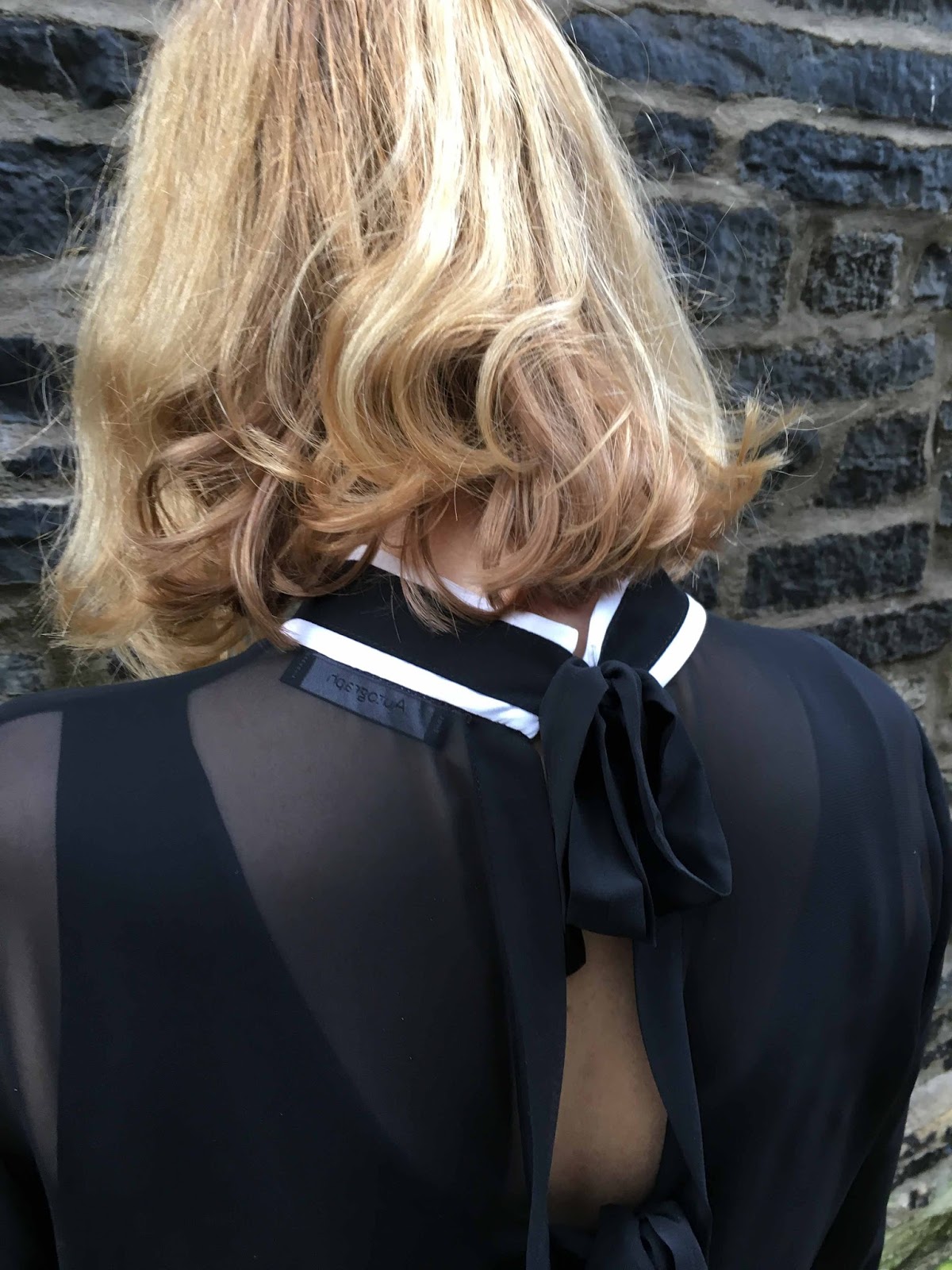 What Lizzy Loves black and white tipped blouse with bell sleeves, black and white hounds tooth shoe boots