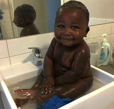  Young African mom celebrates her cute son with the most beautiful black skin