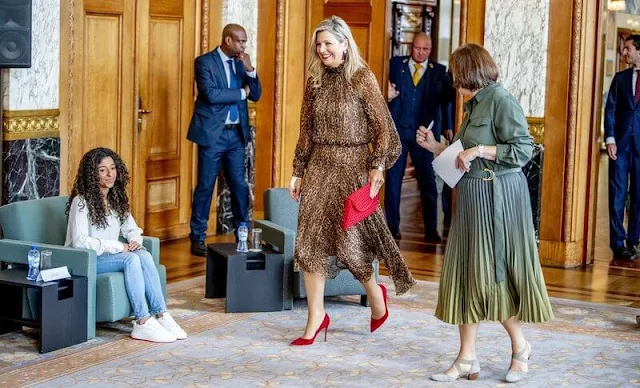 Queen Maxima wore a debora leopard-print midi dress from Natan. Gianvito Rossi red suede pumps and red suede clutch