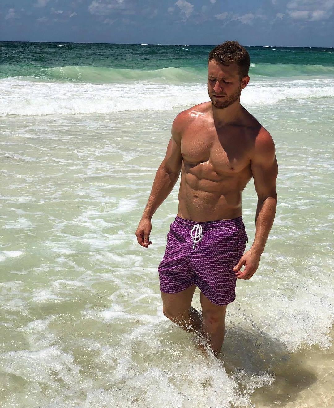 hot-shirtless-muscular-man-water-sea-beefy-purple-shorts-hunk