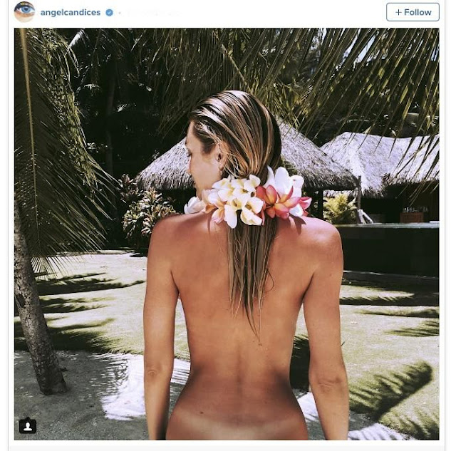 Candice Swanepoel showed off her tan lines while on holiday. Candice Swanepoel showed off her tan lines while on holiday.