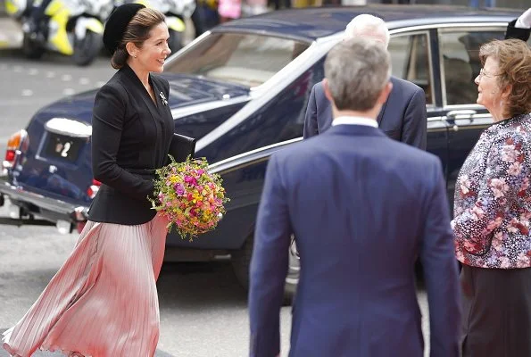 Queen Margrethe, Princess Benedikte. Crown Princess Mary wore a rose gold metallic pleated midi skirt from Asos Design, and a blazer by Max Mara